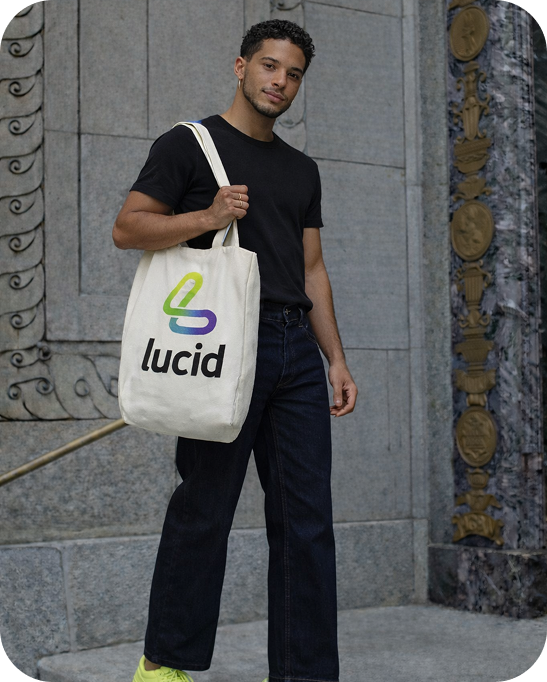 Guy carrying a hand bag branded Lucid App